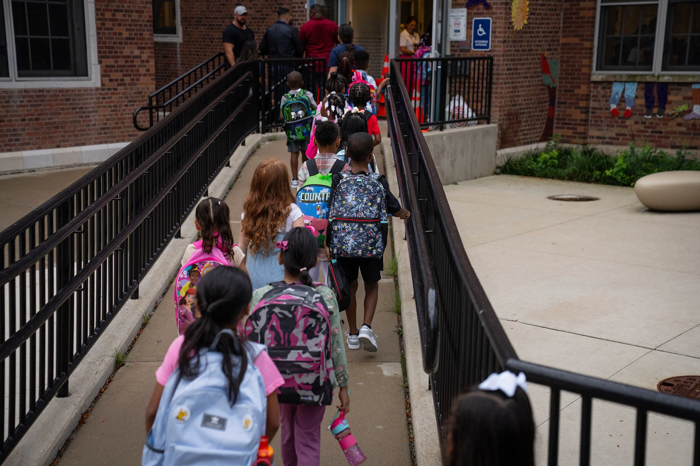 Students file in for the first day of school at Courtenay Language Arts Center in the Uptown neighborhood, Aug. 18, 2025. (E. Jason Wambsgans/Chicago Tribune) Students on the first day of school, 2025